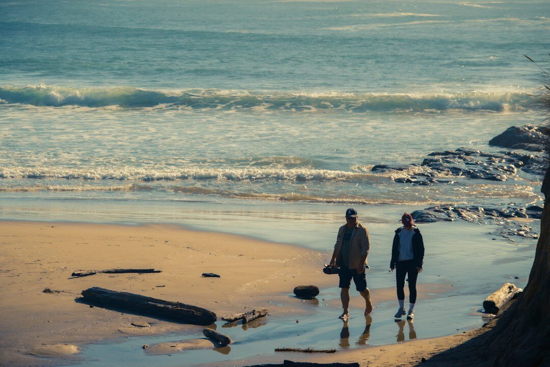 senior couple walking on beach