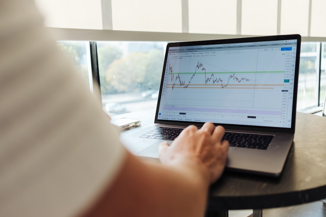 person analyzing financial charts
